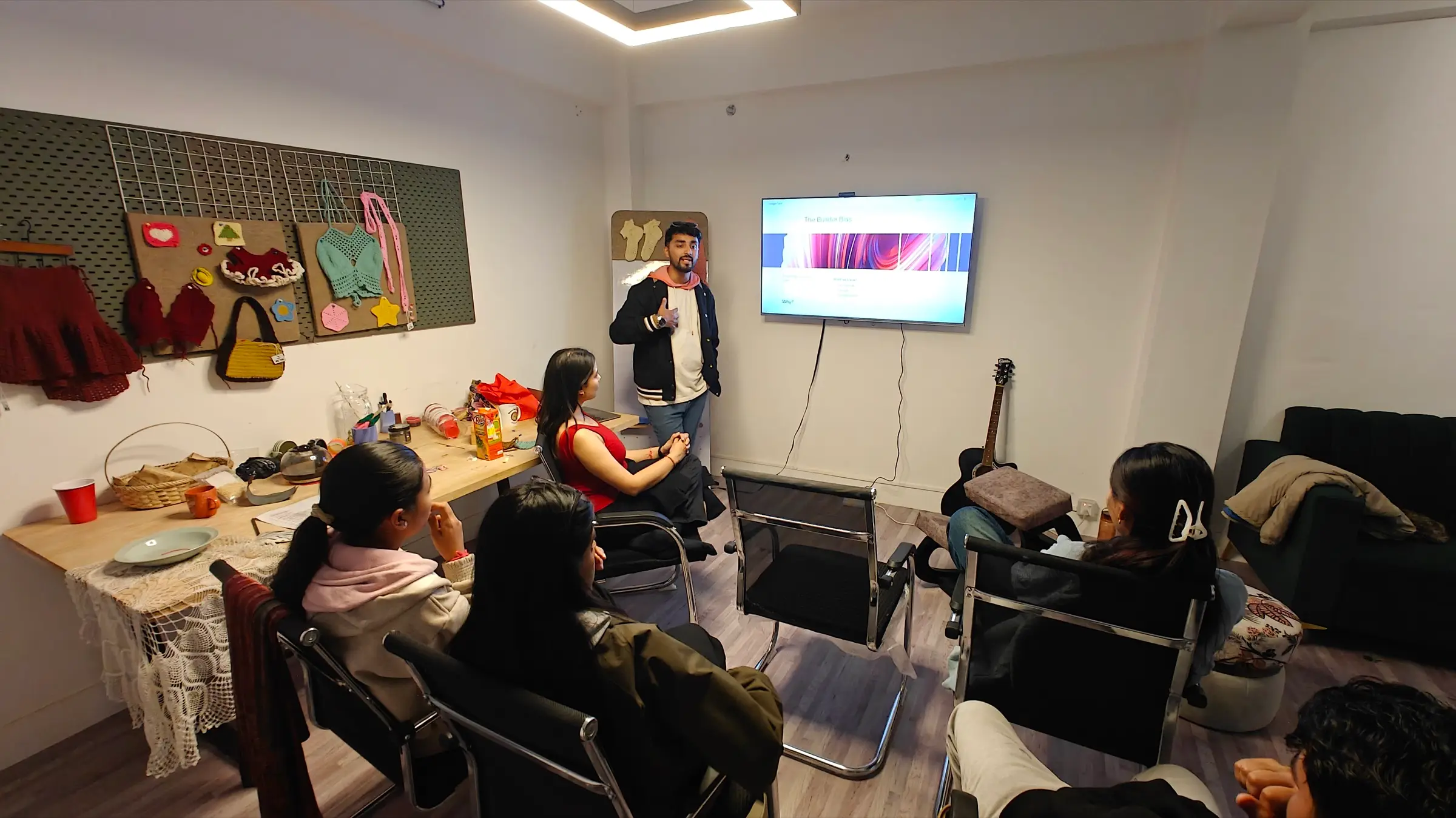 Team gathered for a design crit in the studio