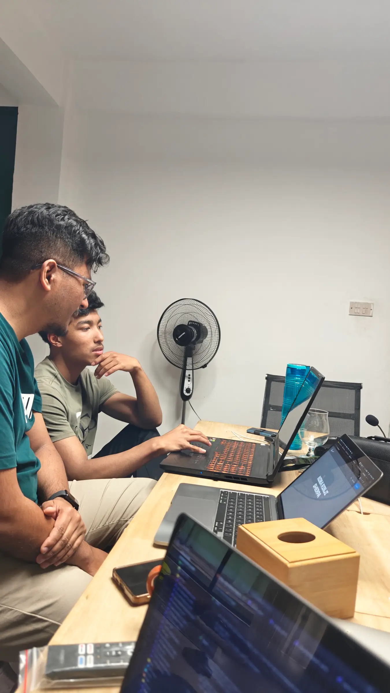 Two teammates pairing on a build at the desk