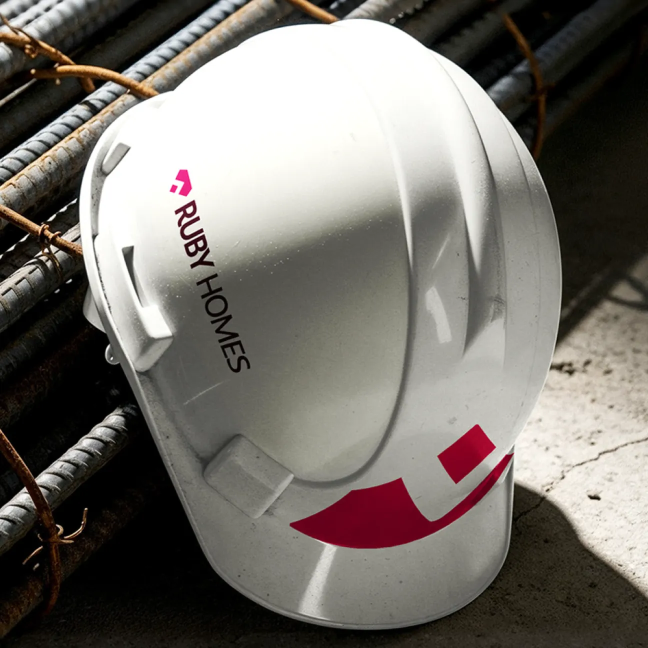 Ruby Homes brand system applied across print and web
