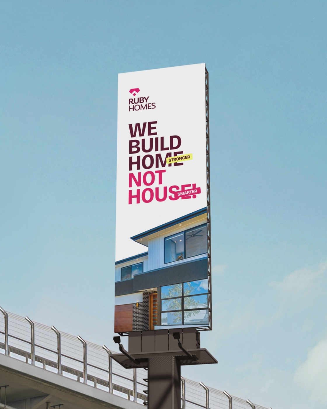 Roadside billboard mockup carrying the We-build-home-not-house key visual