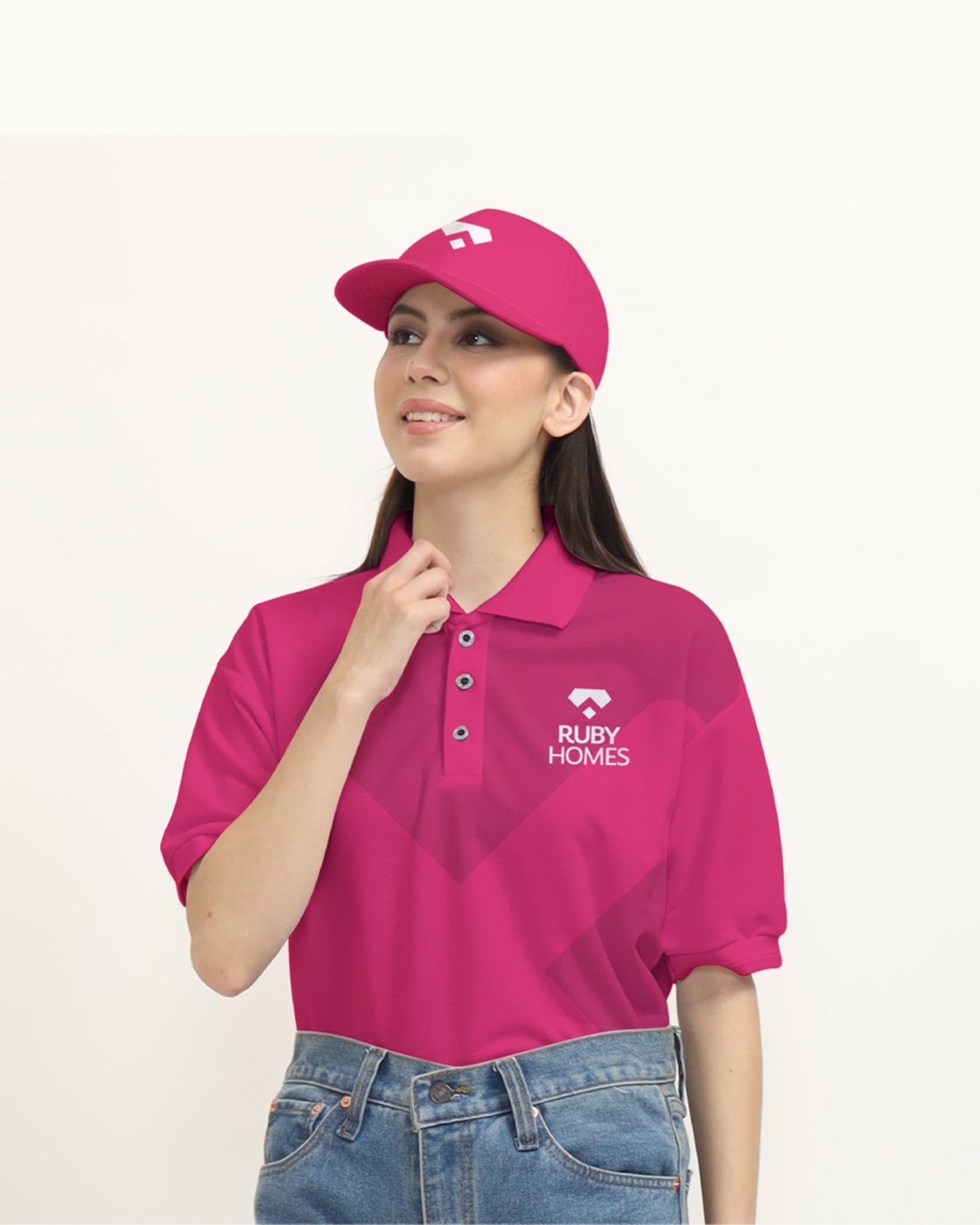 Model wearing a magenta Ruby Homes polo shirt and cap